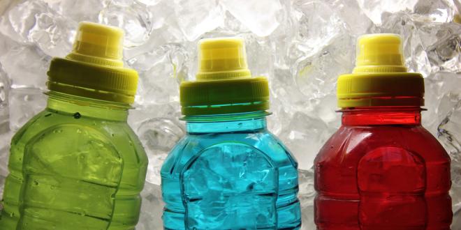 sport bottles with colored liquid inside them
