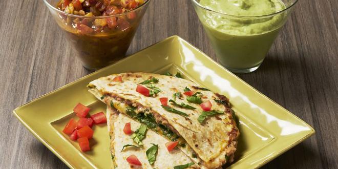 a healthy quesadilla with salsa and guacamole